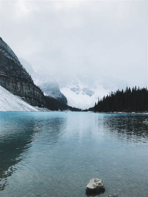 Lake near Snow Covered Mountain · Free Stock Photo