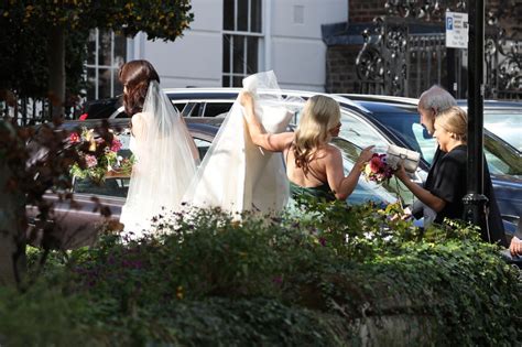 Downton Abbey star Michelle Dockery stuns in satin white gown as she ...