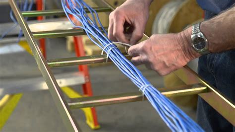 Instructional cable lacing How to sew CAT5 to a cable rack - YouTube