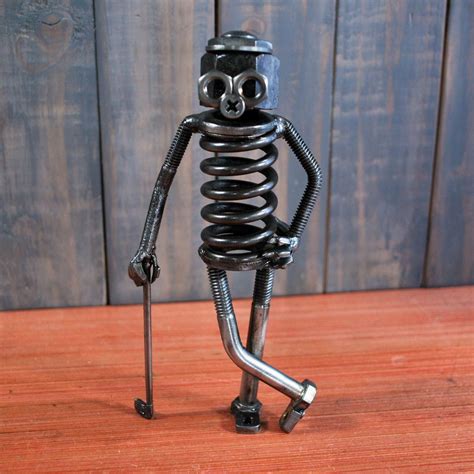 Golfer Bot #metalart | Recycled metal art, Welding art projects, Scrap ...