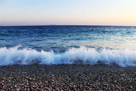 Waves crashing over pebbles on beach image - Free stock photo - Public ...