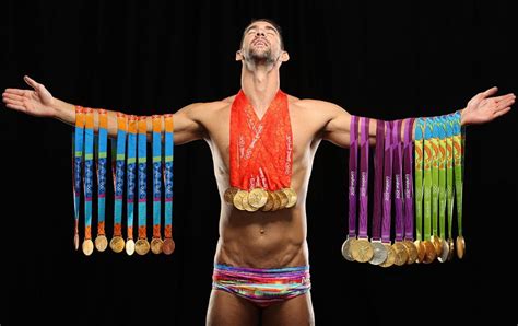 Michael Phelps Poses With All His Gold Medals