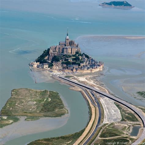 The tiny island of Mont Saint-Michel in Normandy, France, with its ...