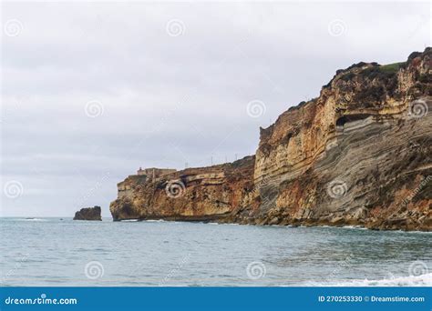 The Cliff in Nazare, Where the Most Famous Lighthouse in the World is ...