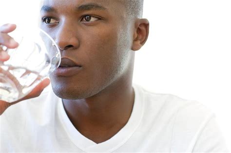 Man Drinking A Glass Of Water Photograph by Ian Hooton/science Photo ...