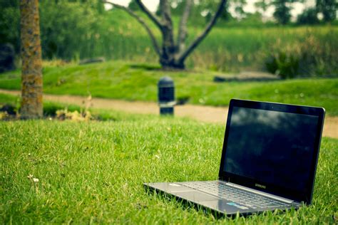 Woman with laptop lying down in bed · Free Stock Photo