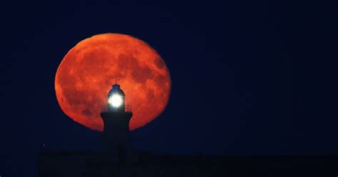 Harvest moon 2016: Incredible images of lunar eclipse lighting up the ...