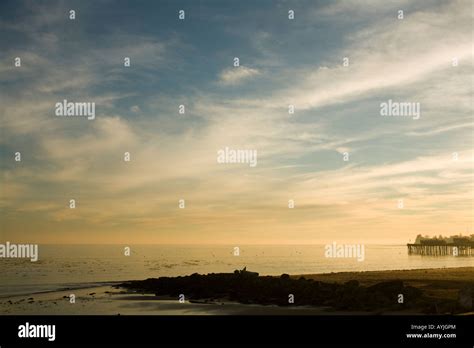 Capitola California beach and Capitola Wharf at sunset Stock Photo - Alamy