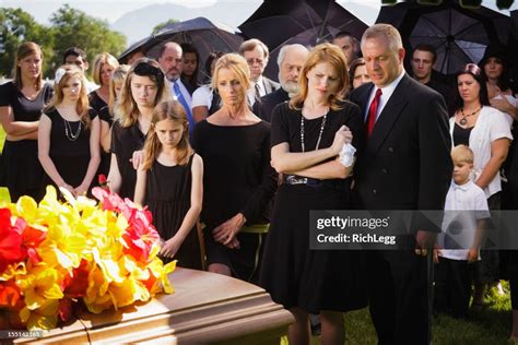 Family At A Funeral High-Res Stock Photo - Getty Images