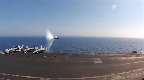 U.S. Navy Jet Breaks Speed Of Sound Flying Past Aircraft Carrier At ...