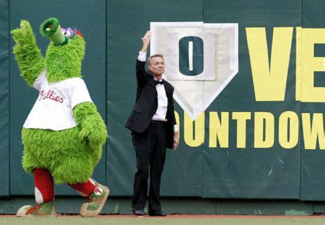 Hall of Fame broadcaster Harry Kalas and the Phanatic wave to the crowd ...