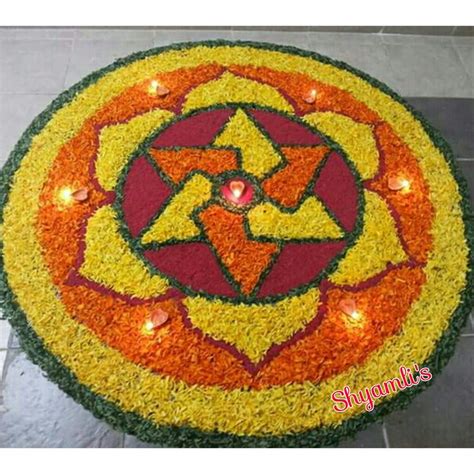 Flower rangoli made using yellow & orange marigold flowers in special ...