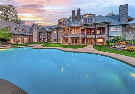 A backyard pool with a waterfall and patio makes a big splash ...