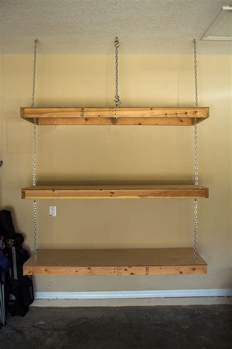 Hanging garage shelves. Eye bolt in ceiling goes through ceiling joist ...