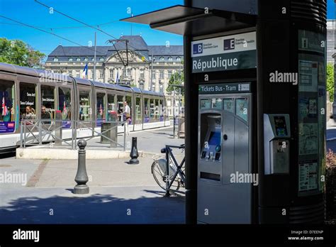 Strasbourg, tram ticket vending machine at tram station, tram carriages ...