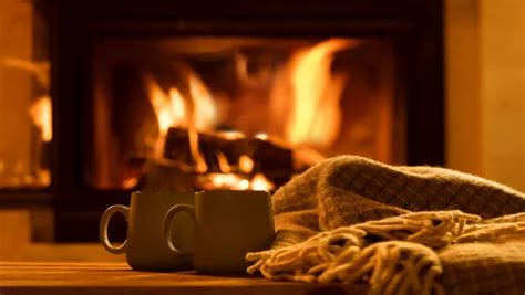 Steam from a cups with a hot cocoa on the fireplace background. - Stock ...