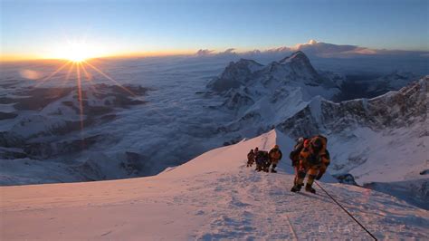 Climbers at sunrise on the balcony of Mt Everest - Elia Saikaly Licensing