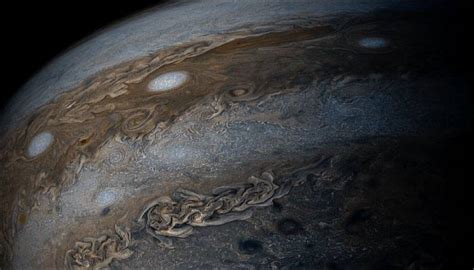 Jupiter gives a brilliant full view of its bands of clouds to Juno in ...