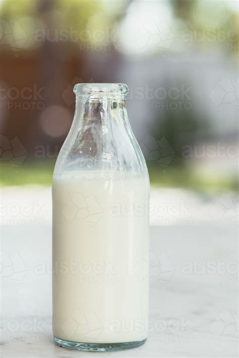 Image of Plain bottle of milk - Austockphoto