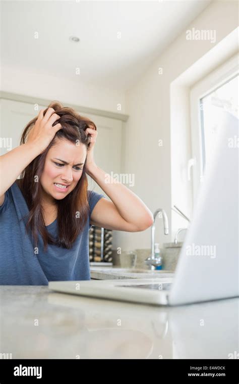 Angry woman with laptop Stock Photo - Alamy