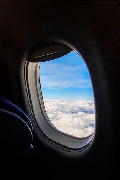 Premium Photo | Airplane window view with landscape outside and copyspace