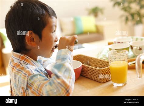 A boy having breakfast Stock Photo - Alamy