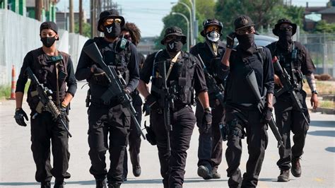 Heavily armed protesters march through Louisville demanding justice for ...