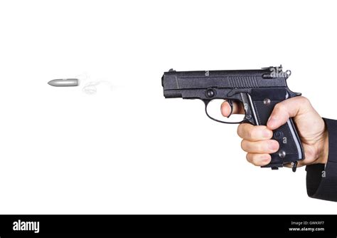 Mans hand shot from a gun. Bullet flying in slow motion Stock Photo - Alamy