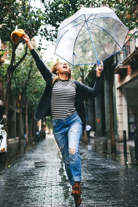 "Woman Enjoying In A Rainy Day." by Stocksy Contributor "BONNINSTUDIO ...