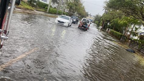 Heavy afternoon thunderstorms flood roadways in Naples