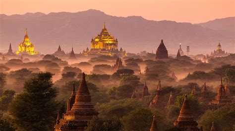 Pagoda landscape under a warm sunset in the plain of Bagan, Myanmar ...