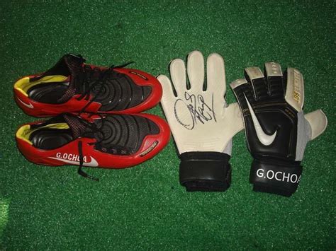 MEMO OCHOA MATCH WORN BOOTS AND GLOVES SIGNED . on PopScreen