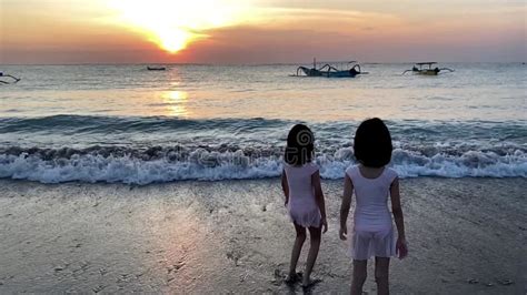 Silhouette of Kids Playing in Beach during Sunset Walking on Water ...