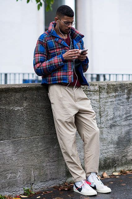 PFW SS18 Street Style featuring a street styler in a tartan puffer ...