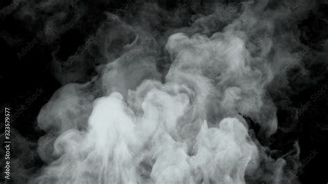 White water vapor steam on a black background. Realistic dry smoke ...