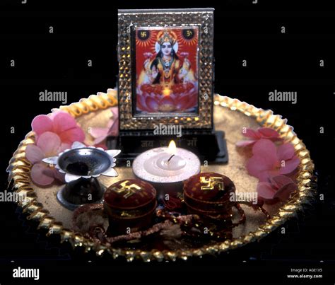 A puja tray with objects offered to the HIndu goddess Lakshmi Stock ...