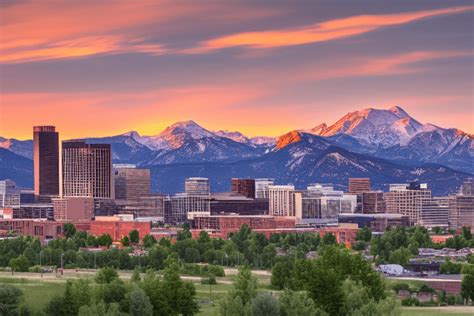 Denver Skyline with Mountain Background at Sunset · Creative Fabrica