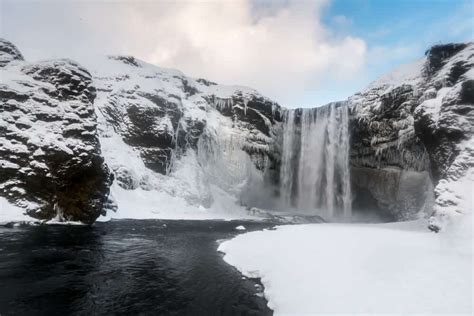 Frozen Skogafoss waterfall during winter in Iceland | I am Reykjavik