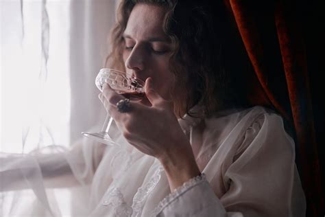 A Person in White Drinking Wine · Free Stock Photo