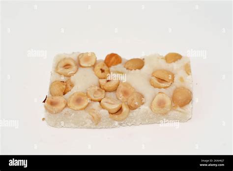 Soft coconut candy covered with hazelnuts, Egyptian cultural desserts ...