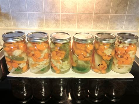 My first attempt at pickled carrots, jalapenos, cauliflower & onions ...