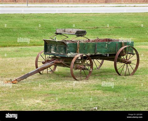 Old green vintage, antique wooden horse drawn wagon from the 1800s in ...