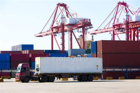 Cranes and cargo containers in shipping dock — Efficiency, Commercial ...