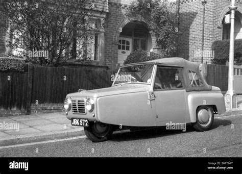 Reliant Regal Mk 1 three wheel car parked outside family home 1953 ...