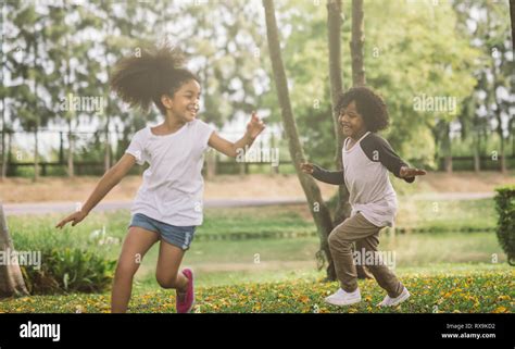 Kids playing with friends. Children Running At Park Stock Photo - Alamy