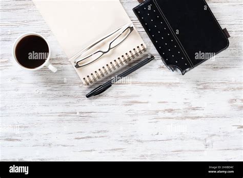 Top view office desk with white cup of coffee Stock Photo - Alamy