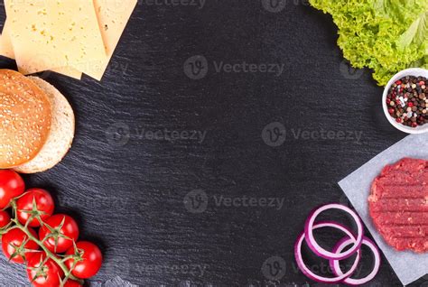 The ingredients for the burger on black slate background 11914416 Stock ...