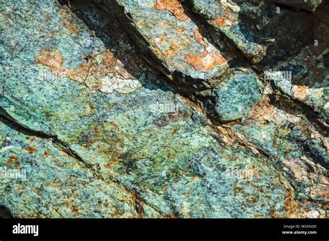 Natural Surface texture of serpentinite. Background with green mineral ...