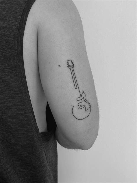 Minimal Guitar Tattoo | Guitar tattoo, Music tattoo designs, Small ...