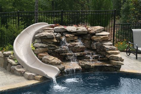 Natural slide with stacked stone waterfall | Backyard pool, Building a ...